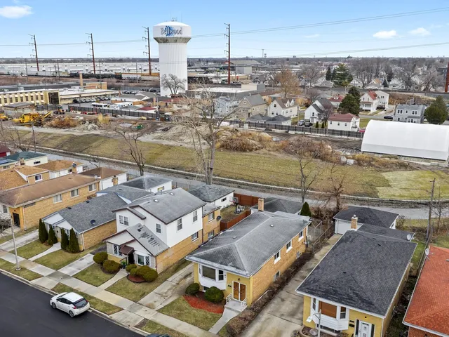 an aerial view of a house with a ocean view