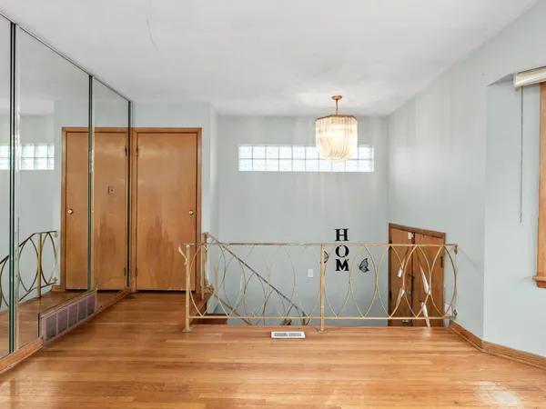 a view of a livingroom with wooden floor