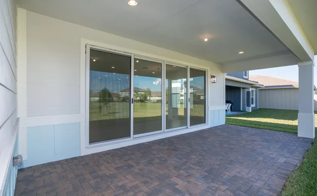a view of an house with backyard and kitchen