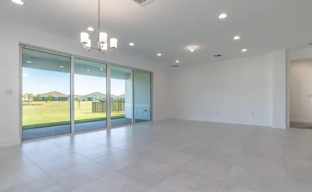 a view of an empty room with glass door