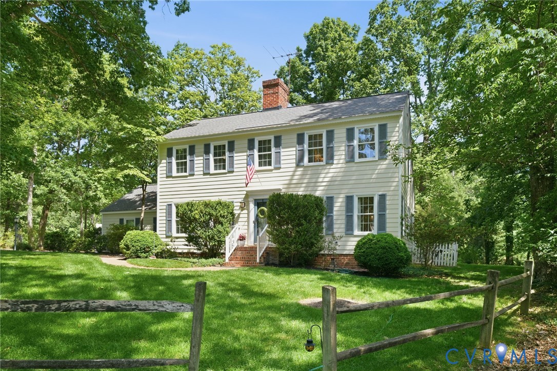 2101 Castlebridge Road Midlothian, VA 23113 - Photo 2 of 37 a front view of a house with a yard and trees