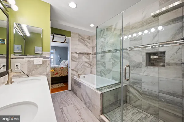 a bathroom with a tub and shower