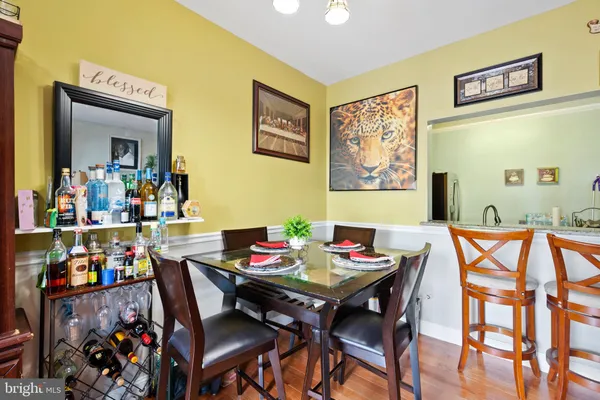 a view of a dining room with furniture and wooden floor