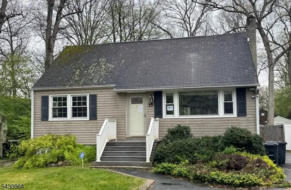 a view of a house with a yard and plants