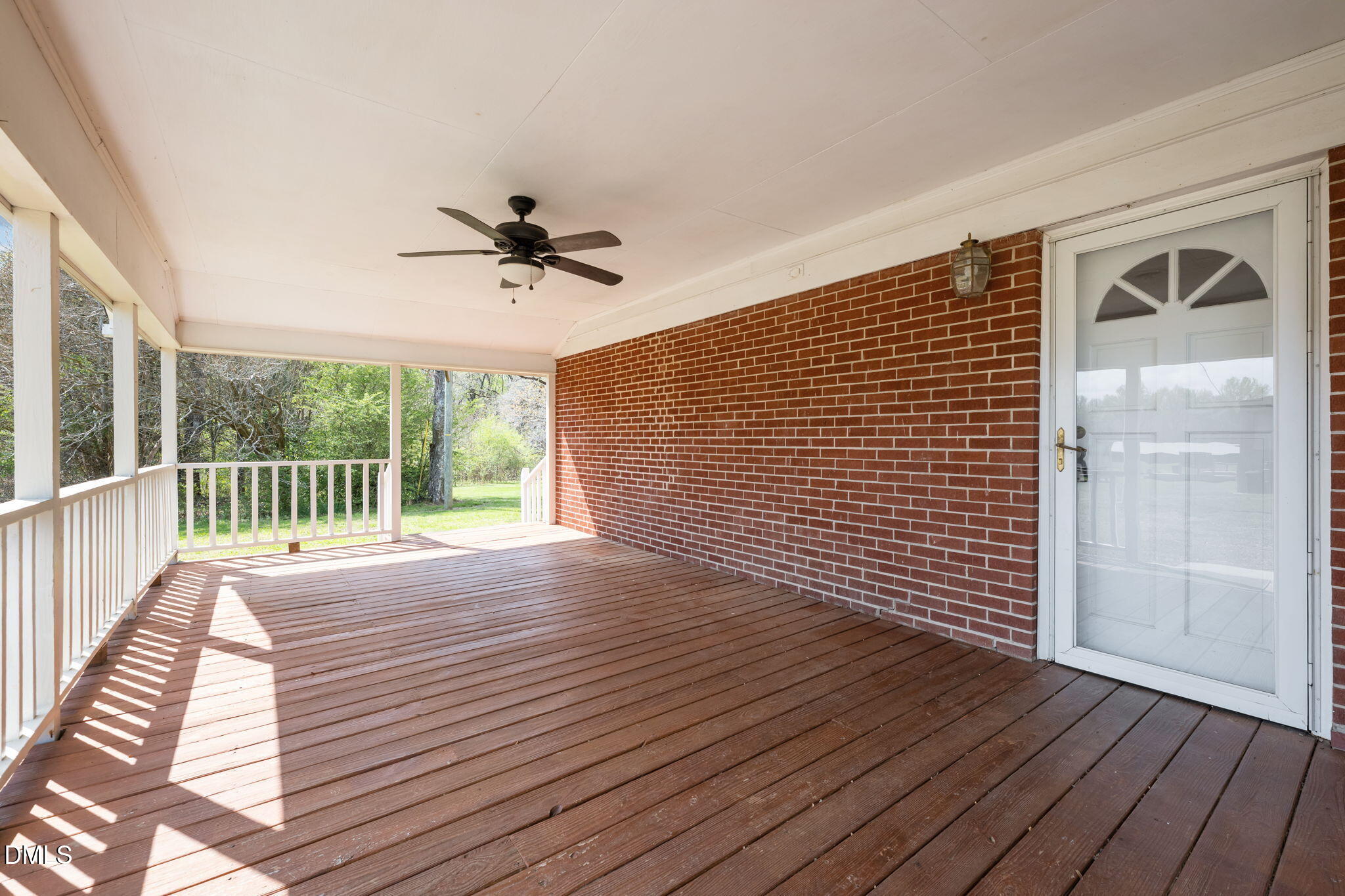 2251 Castle Rock Farm Road Pittsboro, NC 27312 - Photo 13 of 78 a view of a livingroom with wooden floor and a ceiling fan