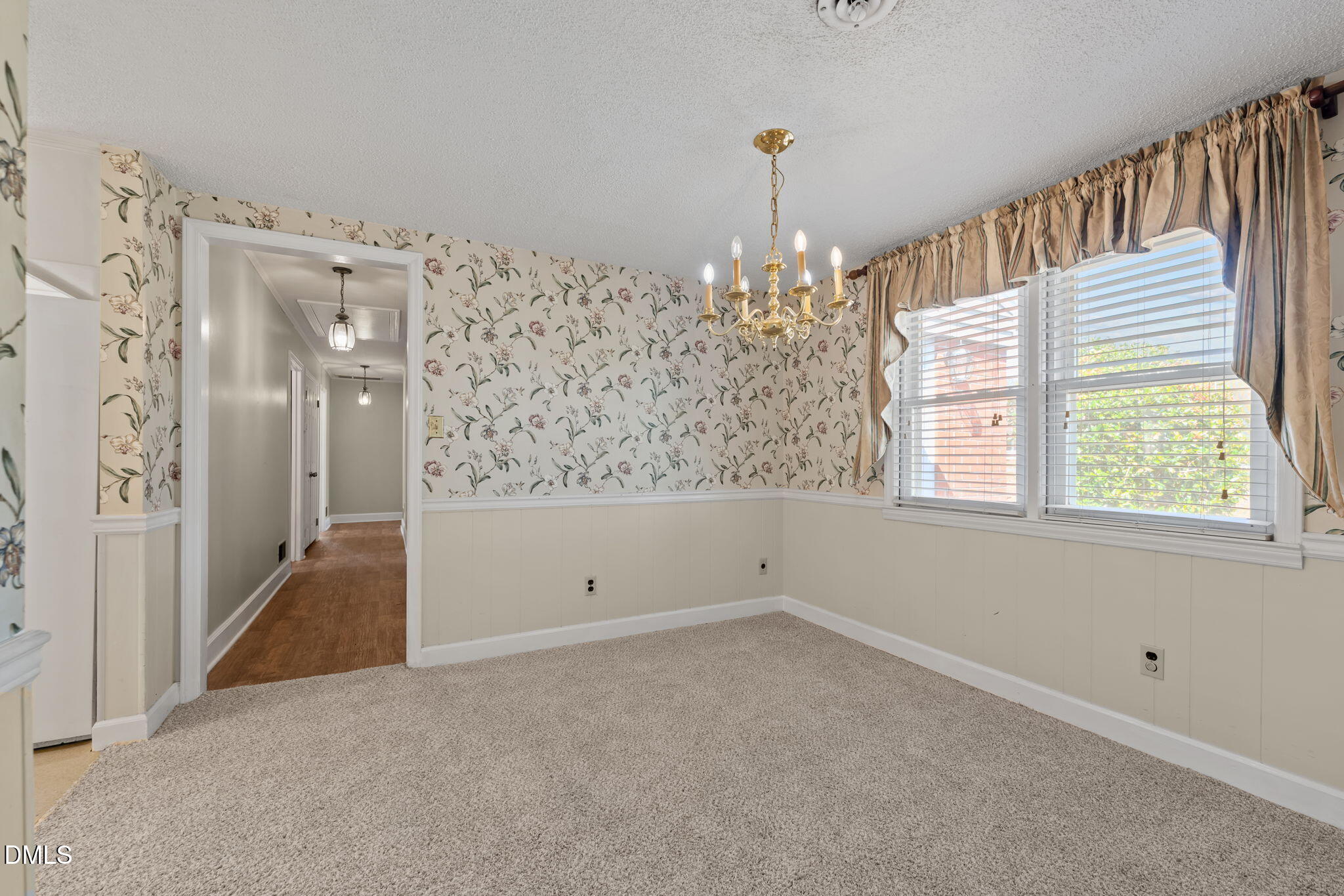 2251 Castle Rock Farm Road Pittsboro, NC 27312 - Photo 21 of 78 a view of a big room with windows and chandelier