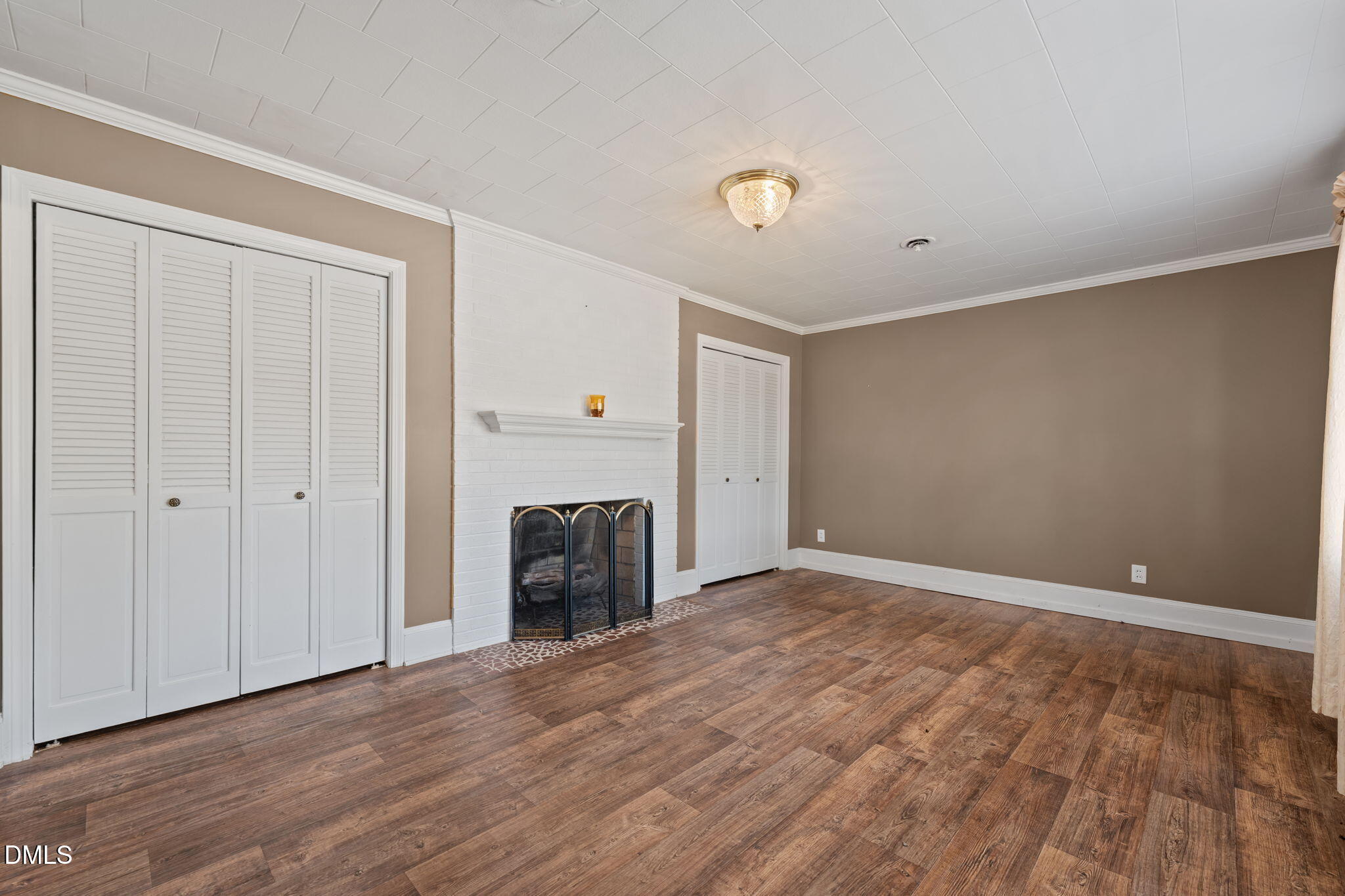 2251 Castle Rock Farm Road Pittsboro, NC 27312 - Photo 28 of 78 a view of an empty room with wooden floor and a window