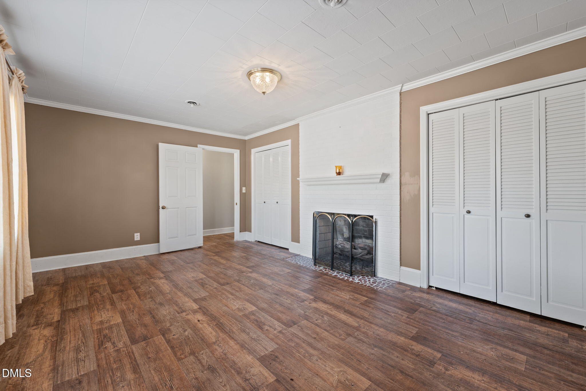 2251 Castle Rock Farm Road Pittsboro, NC 27312 - Photo 29 of 78 a view of empty room with wooden floor and fireplace