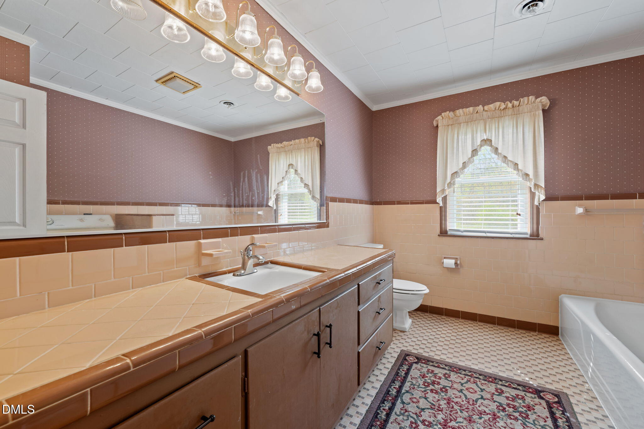 2251 Castle Rock Farm Road Pittsboro, NC 27312 - Photo 30 of 78 a bathroom with a granite countertop sink a toilet and a mirror