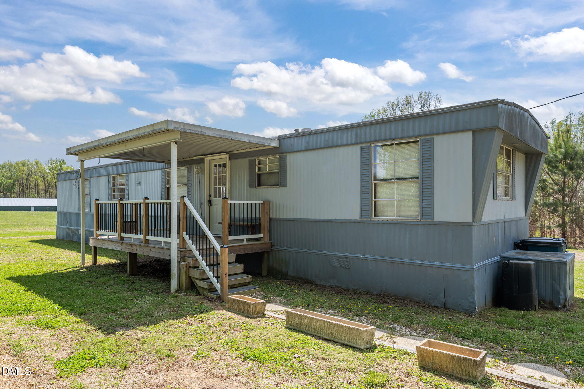 2251 Castle Rock Farm Road Pittsboro, NC 27312 - Photo 40 of 78 a front view of a house with a yard