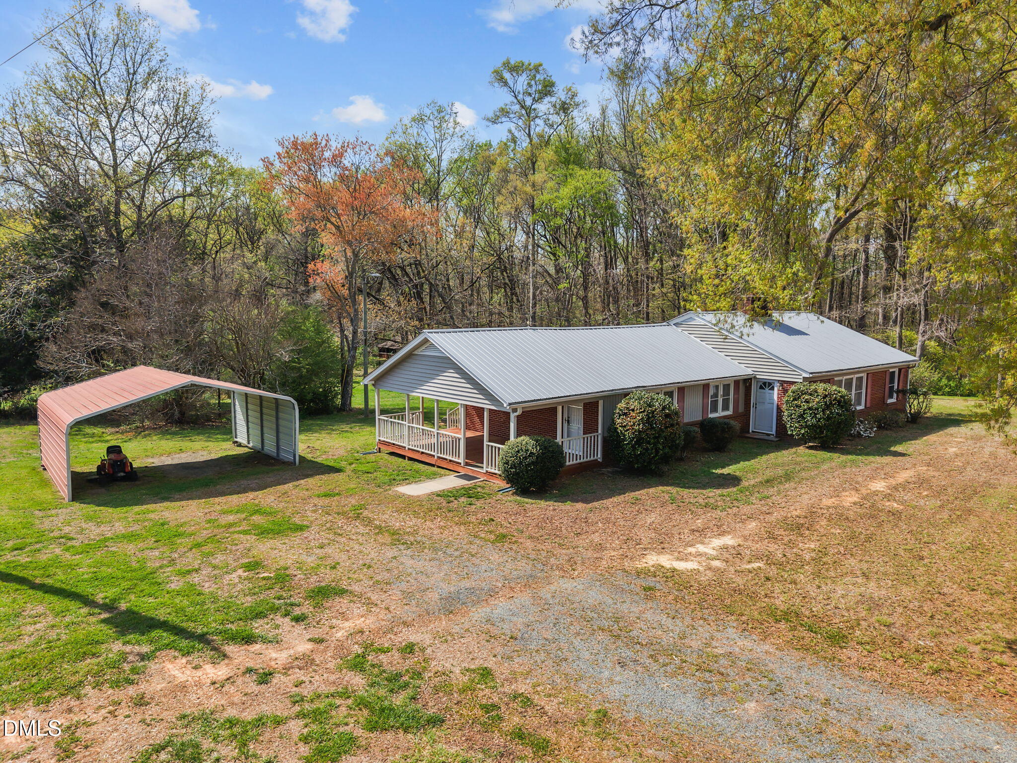 2251 Castle Rock Farm Road Pittsboro, NC 27312 - Photo 4 of 78 a house with trees in the background