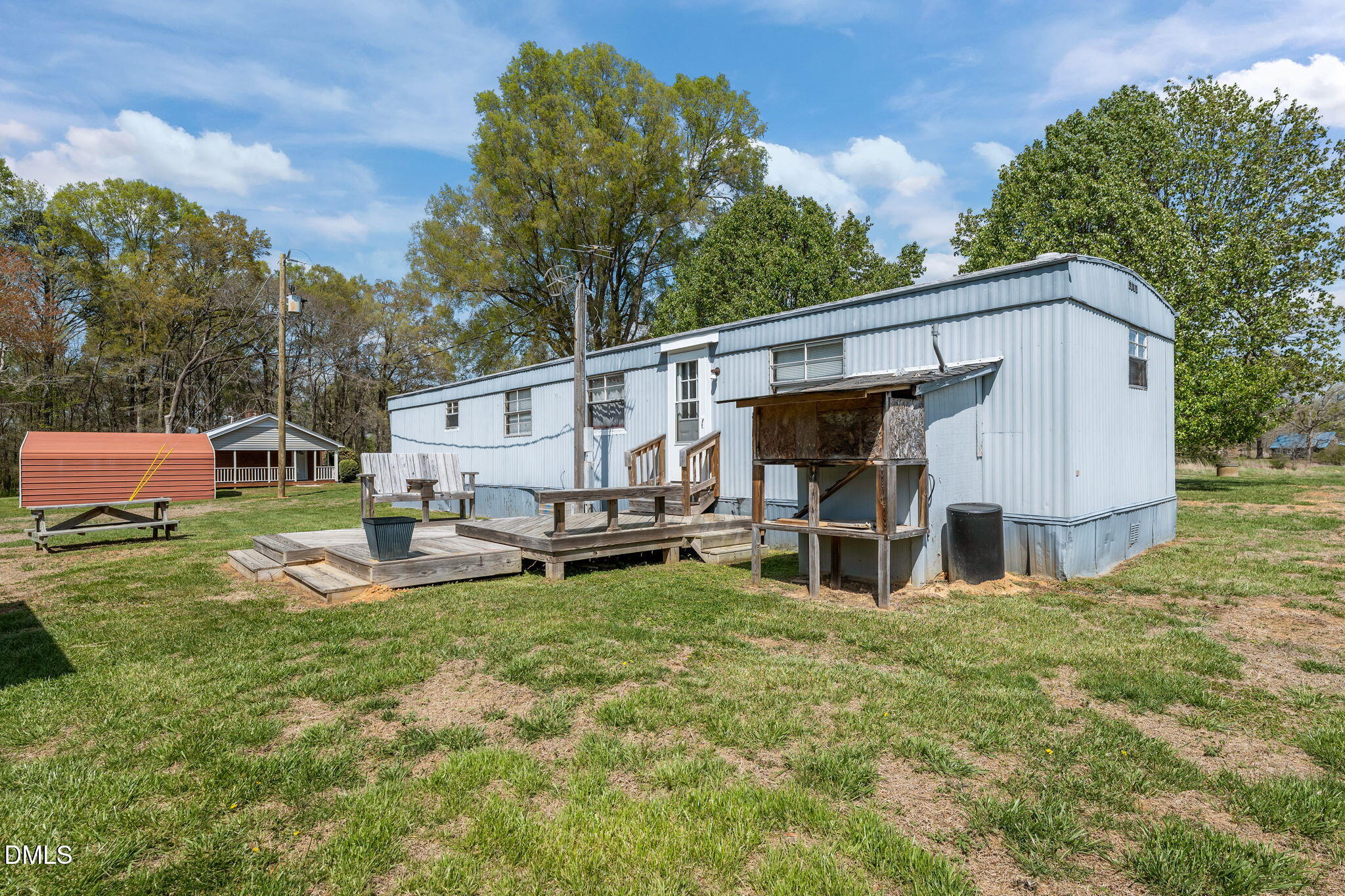 2251 Castle Rock Farm Road Pittsboro, NC 27312 - Photo 44 of 78 a view of a house with backyard and sitting area