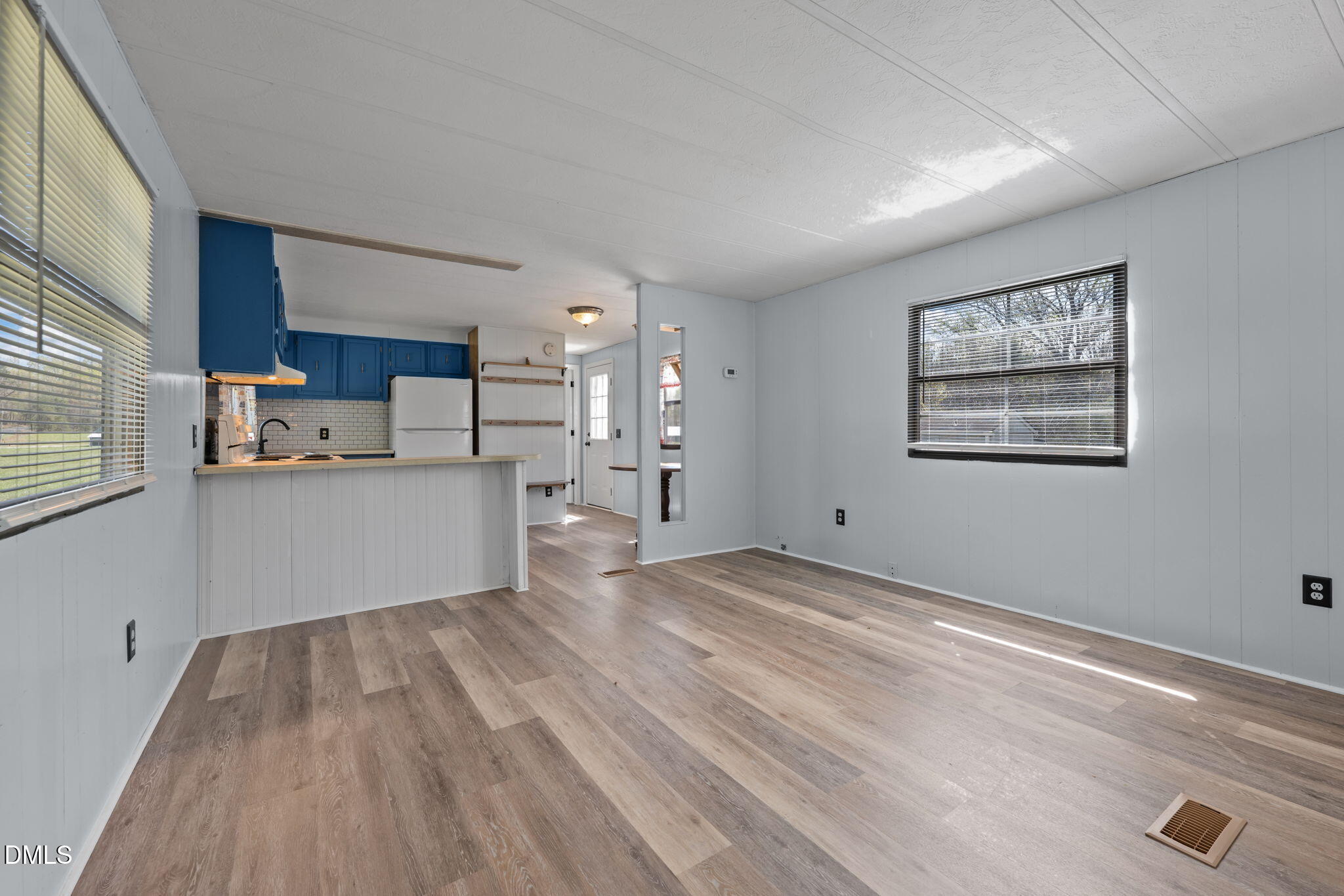 2251 Castle Rock Farm Road Pittsboro, NC 27312 - Photo 51 of 78 a view of a kitchen with wooden floor and electronic appliances