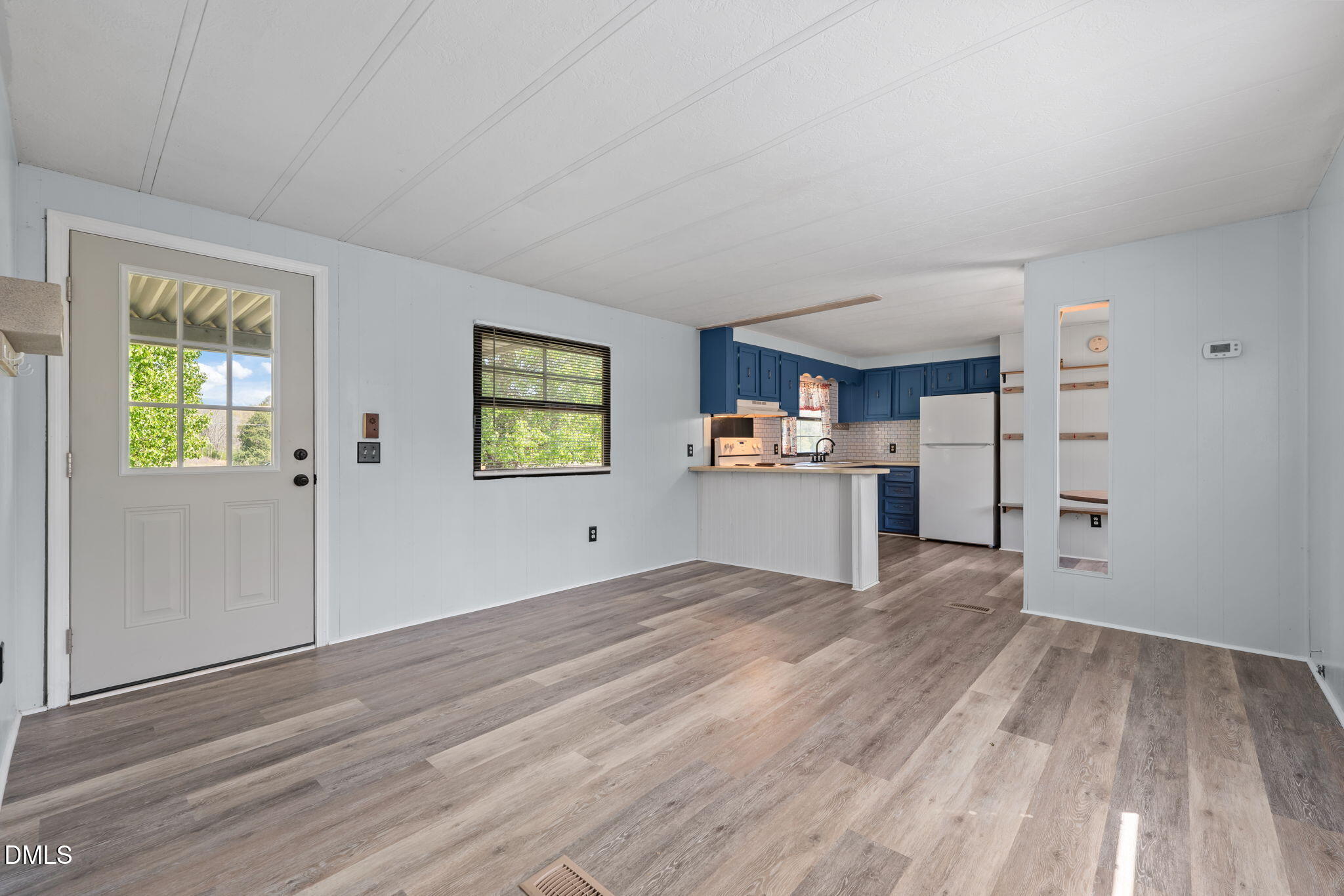 2251 Castle Rock Farm Road Pittsboro, NC 27312 - Photo 53 of 78 a view of a kitchen with wooden floor electronic appliances and window
