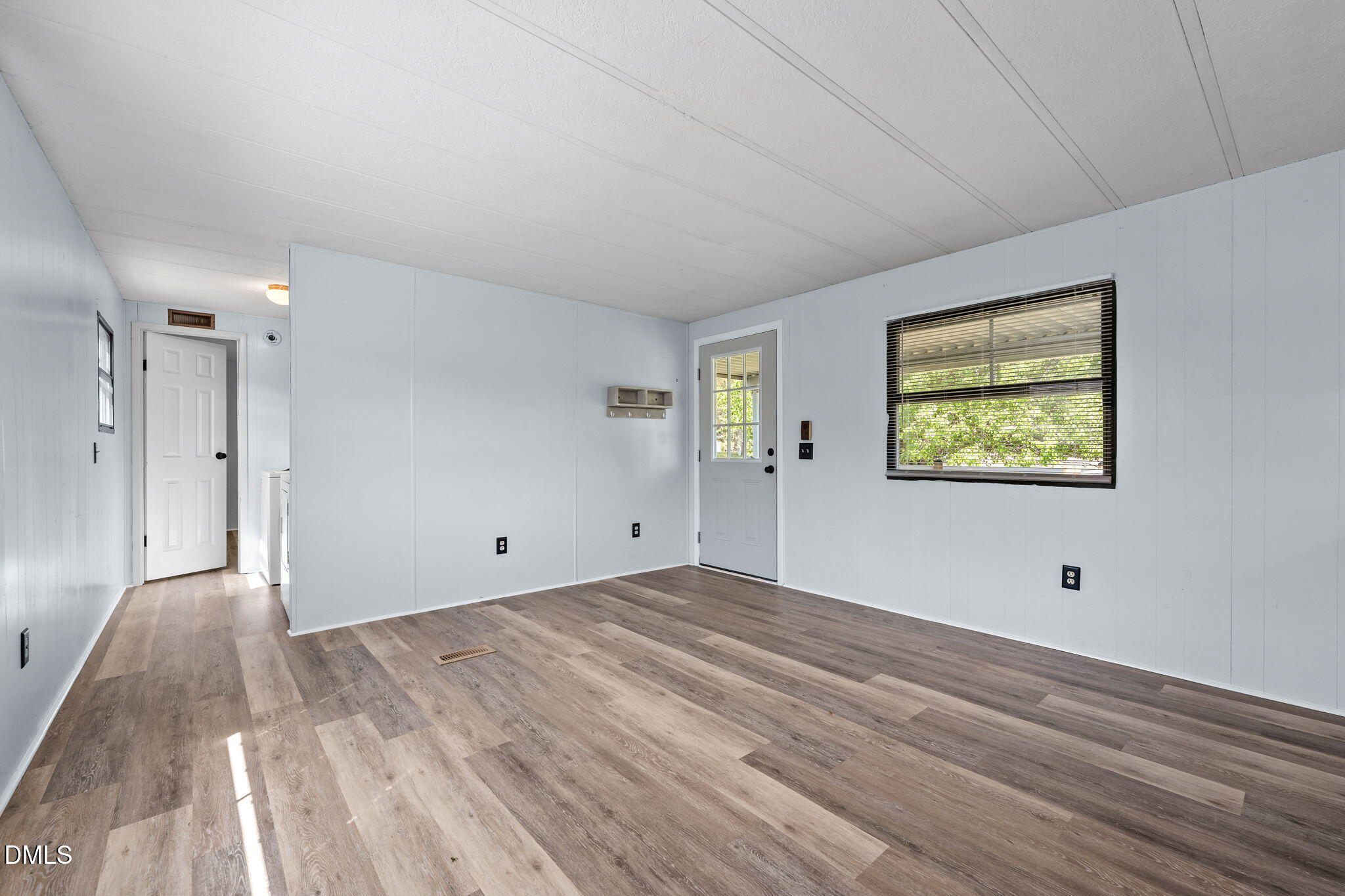 2251 Castle Rock Farm Road Pittsboro, NC 27312 - Photo 54 of 78 a view of an empty room with wooden floor and window