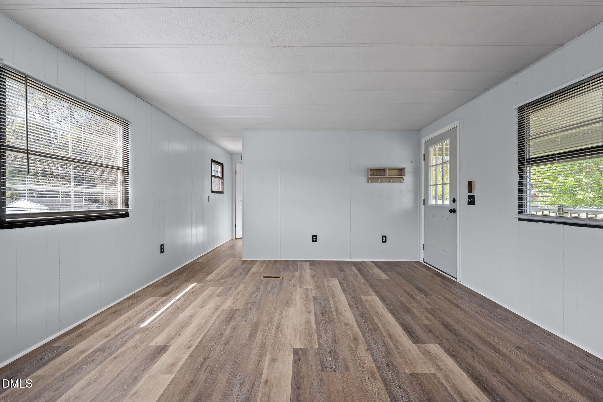 2251 Castle Rock Farm Road Pittsboro, NC 27312 - Photo 55 of 78 an empty room with wooden floor and windows