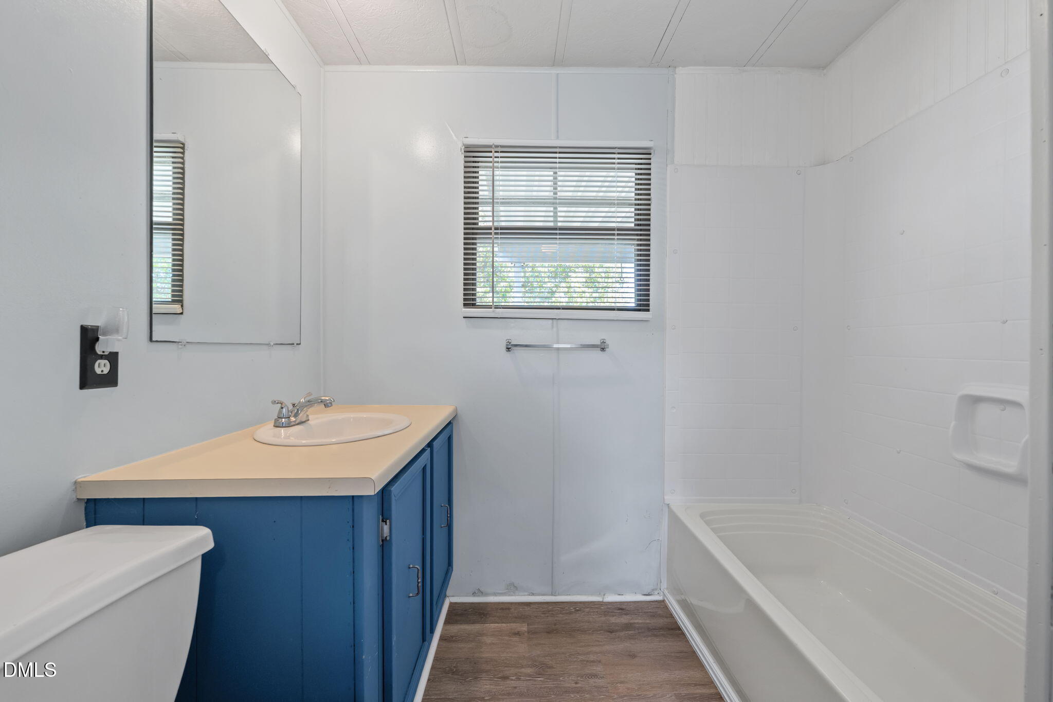 2251 Castle Rock Farm Road Pittsboro, NC 27312 - Photo 58 of 78 a bathroom with a sink toilet vanity and bathtub