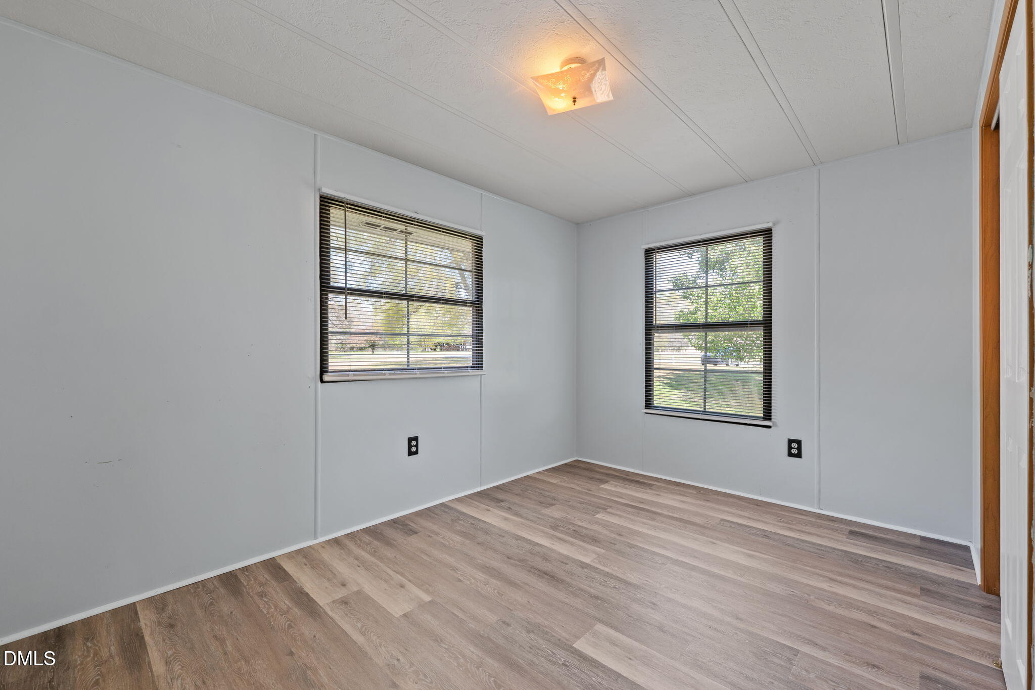 2251 Castle Rock Farm Road Pittsboro, NC 27312 - Photo 59 of 78 a view of empty room with wooden floor and fan