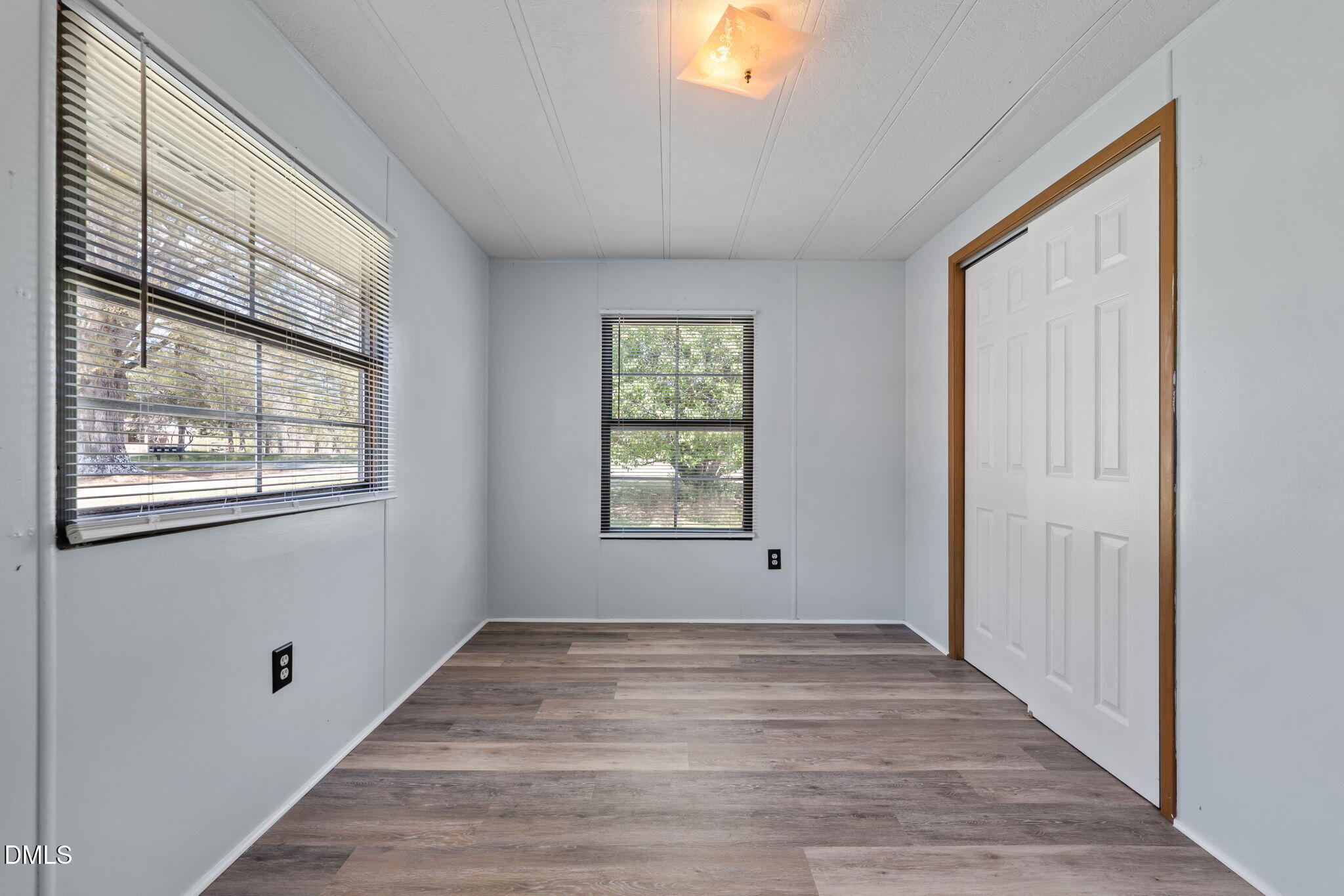 2251 Castle Rock Farm Road Pittsboro, NC 27312 - Photo 60 of 78 a view of an empty room with wooden floor and a window