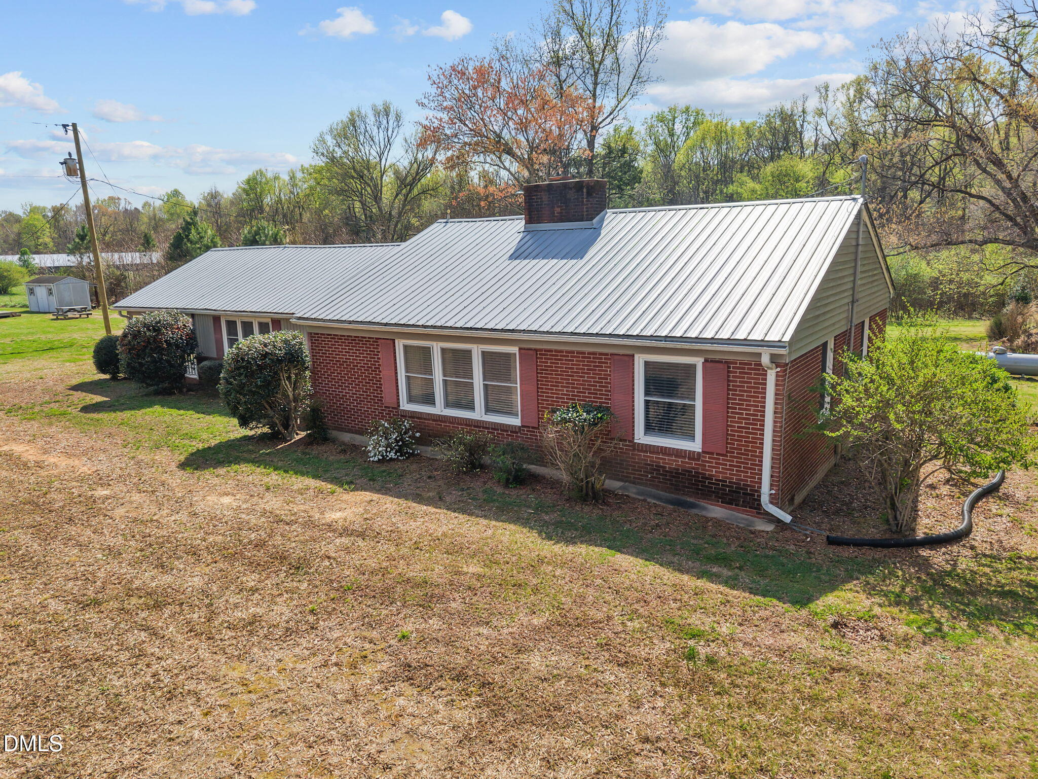 2251 Castle Rock Farm Road Pittsboro, NC 27312 - Photo 6 of 78 a front view of a house with garden