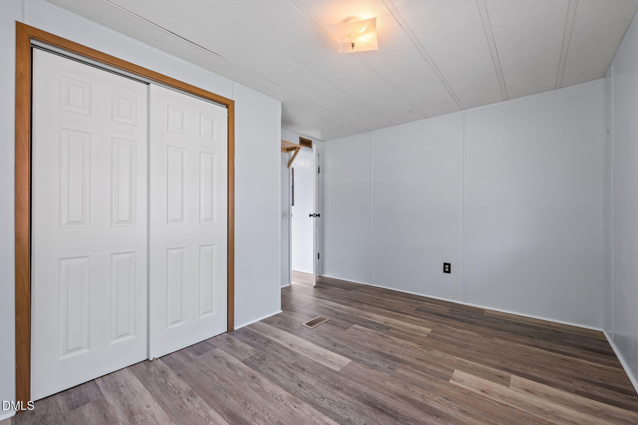 2251 Castle Rock Farm Road Pittsboro, NC 27312 - Photo 61 of 78 a view of an empty room with wooden floor and a window