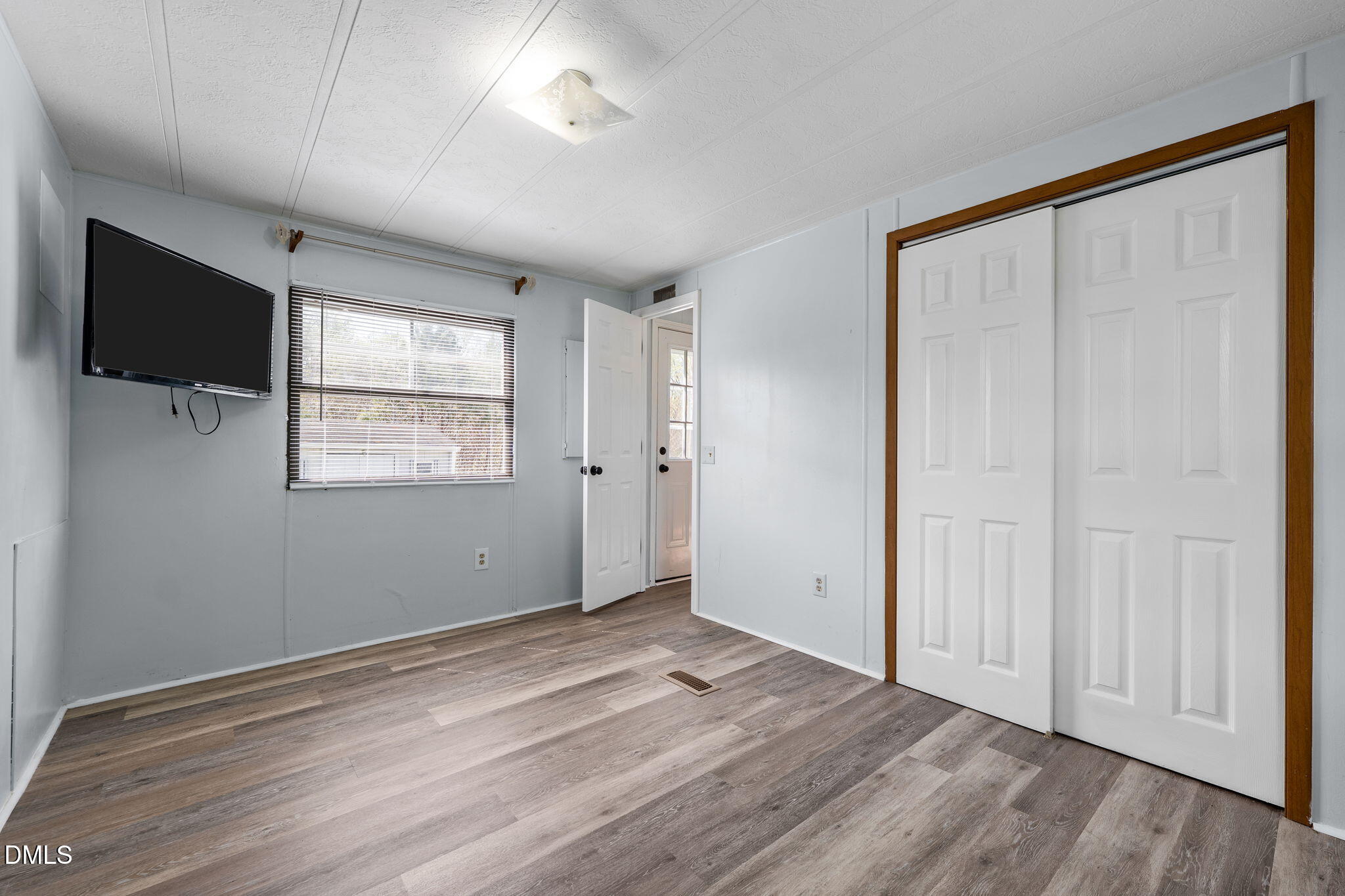 2251 Castle Rock Farm Road Pittsboro, NC 27312 - Photo 66 of 78 a view of empty room with wooden floor and fan