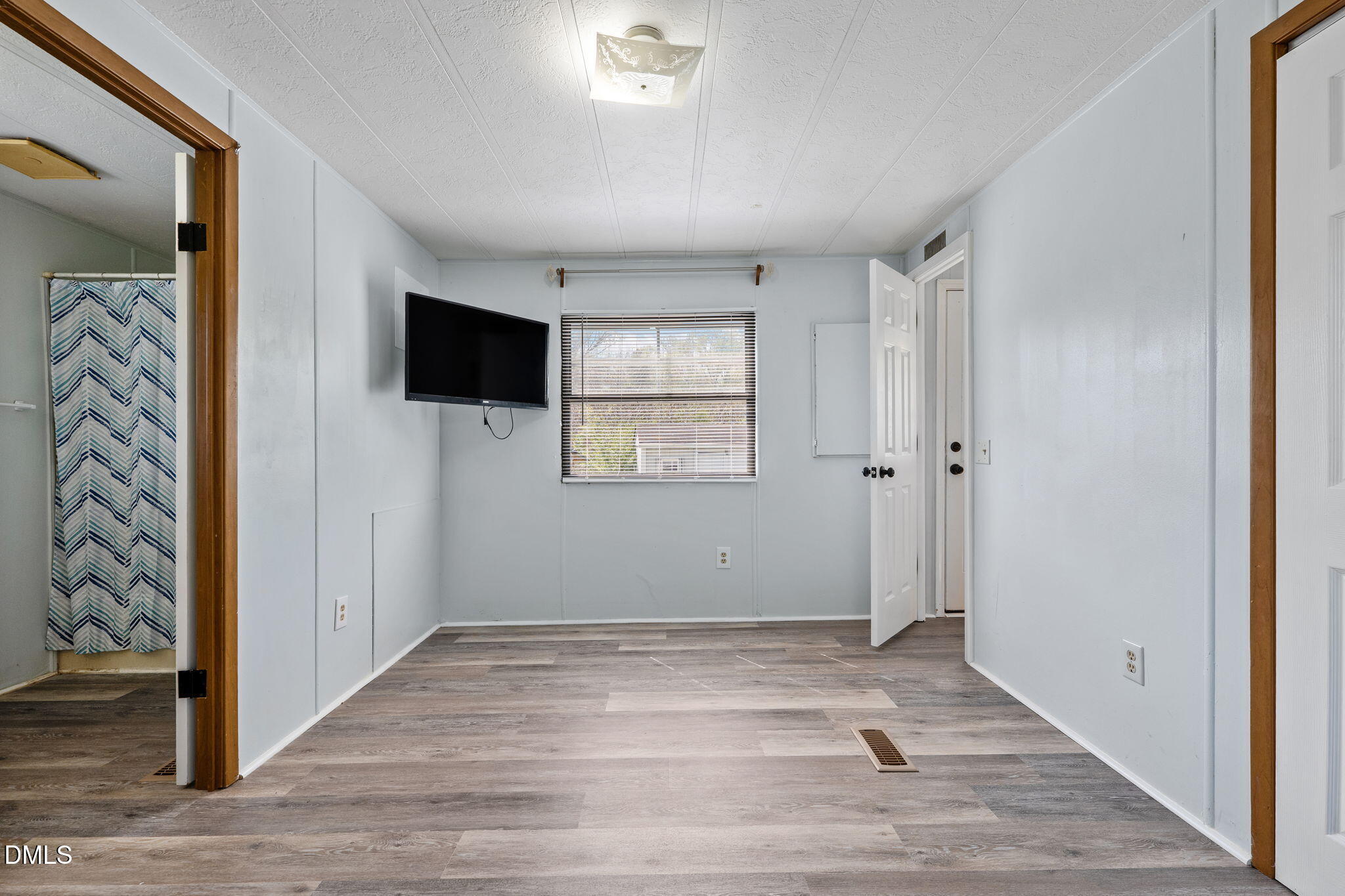 2251 Castle Rock Farm Road Pittsboro, NC 27312 - Photo 67 of 78 wooden floor in an empty room with a window
