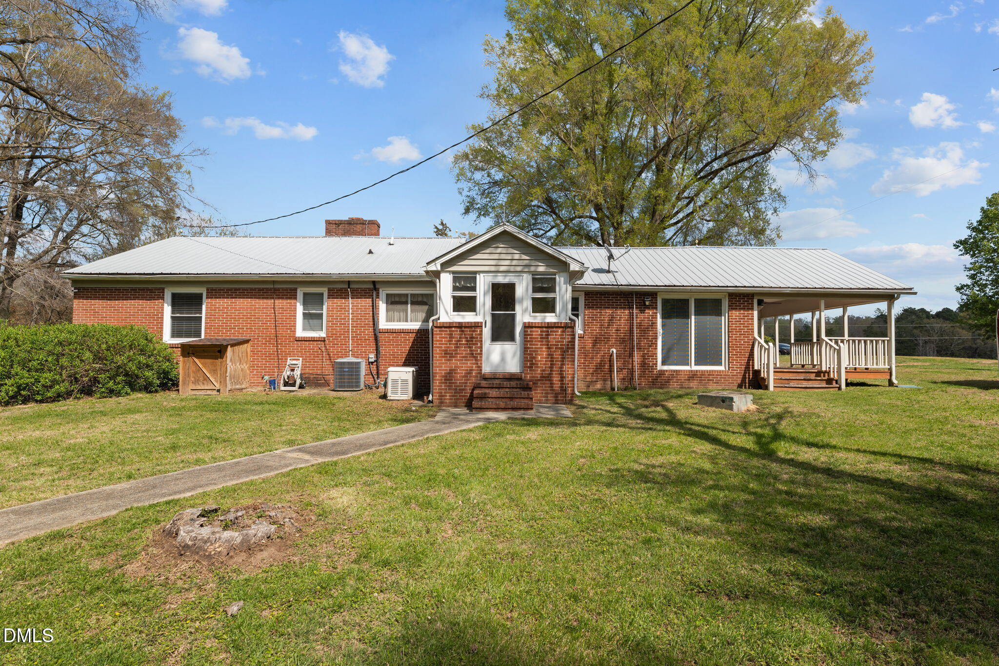 2251 Castle Rock Farm Road Pittsboro, NC 27312 - Photo 7 of 78 a front view of a house with a garden