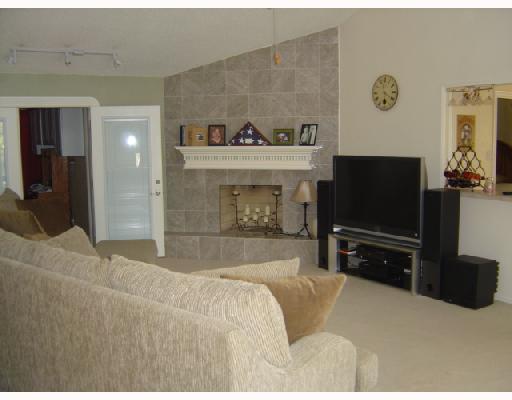4126 Rippling Creek Drive Corpus Christi, TX 78410 - Photo 2 of 10 a living room with furniture and a flat screen tv