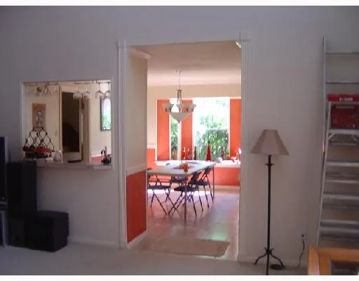 a living room with furniture and a walk in closet
