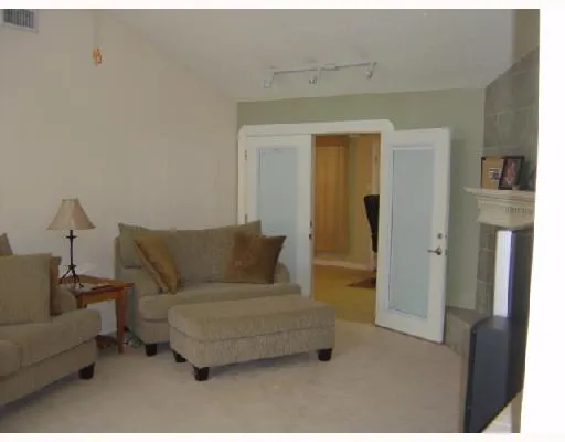 a kitchen with stainless steel appliances granite countertop a refrigerator and a stove
