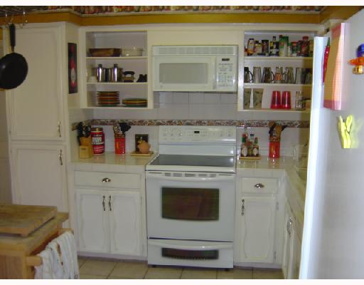 4126 Rippling Creek Drive Corpus Christi, TX 78410 - Photo 9 of 10 a kitchen with stainless steel appliances granite countertop a refrigerator and a stove
