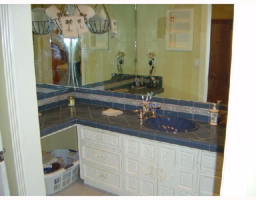 4126 Rippling Creek Drive Corpus Christi, TX 78410 - Photo 10 of 10 a bathroom with a sink and a mirror