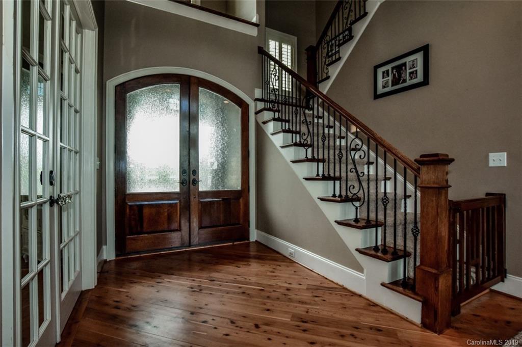 300 Ervin Road Mooresville, NC 28117 - Photo 12 of 32 a view of staircase with wooden floor and a window