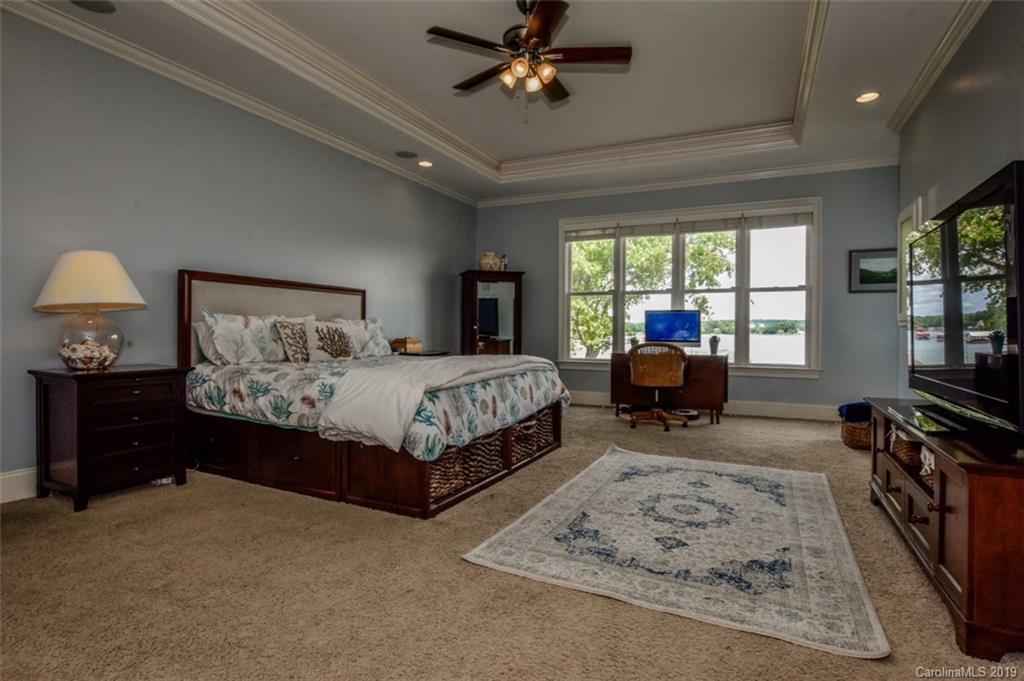 300 Ervin Road Mooresville, NC 28117 - Photo 16 of 32 a bedroom with a bed furniture flat screen tv and window