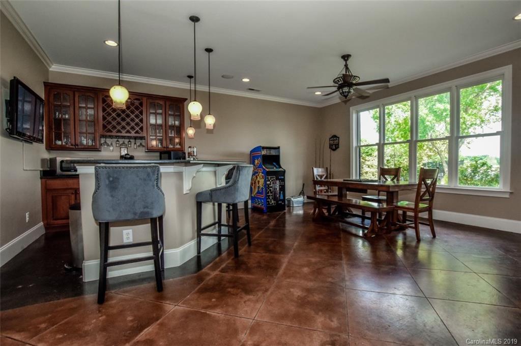 300 Ervin Road Mooresville, NC 28117 - Photo 27 of 32 a view of a dining area with furniture window and outside view