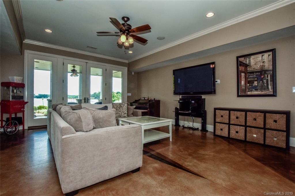 300 Ervin Road Mooresville, NC 28117 - Photo 29 of 32 a living room with furniture and a flat screen tv with wooden floor