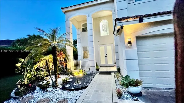 a view of a potted plants in front of a house
