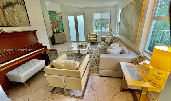 a living room with furniture and a flat screen tv