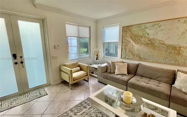 a living room with furniture and a rug