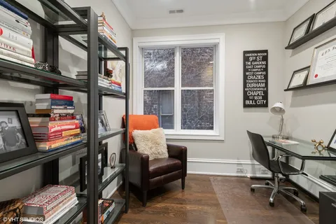 a reading room with furniture and a window