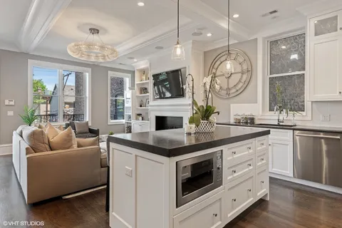 a kitchen with a stove oven and a large window