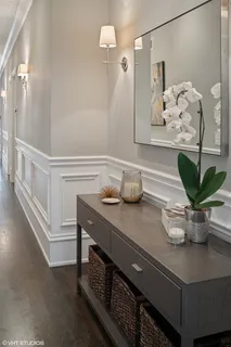a kitchen with a table and a potted plant