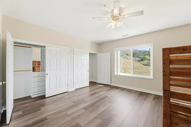 a living room with stainless steel appliances kitchen island granite countertop furniture and a fireplace