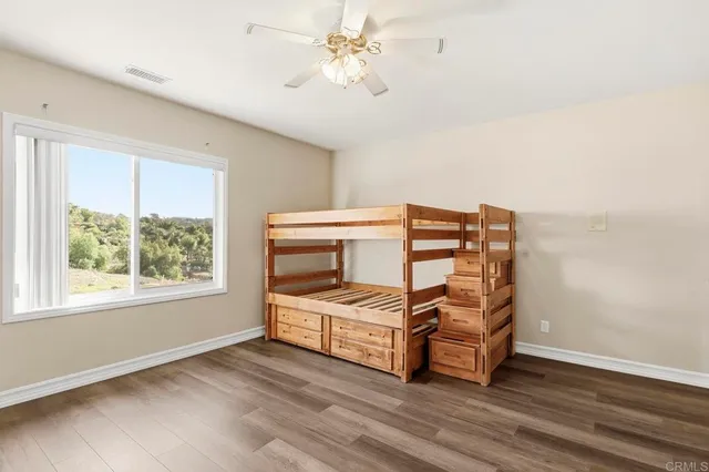 a large bathroom with a large tub and vanity