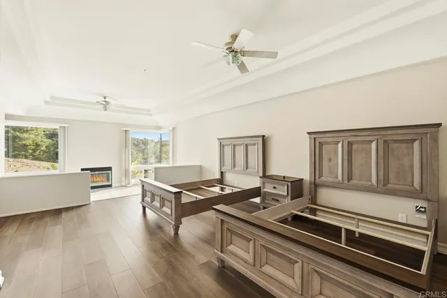 a kitchen with white cabinets and sink