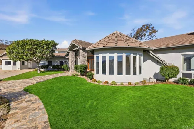 a view of a house with a yard