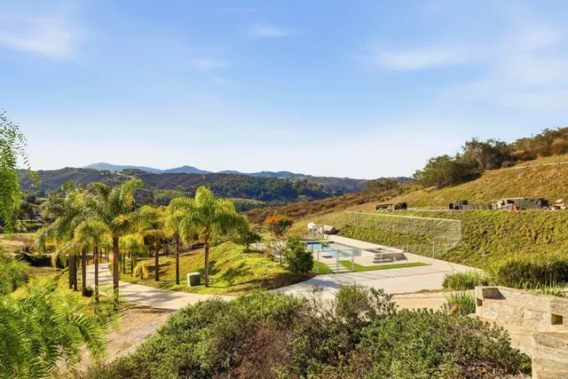 a view of an ocean with a mountain