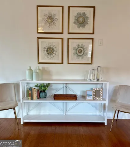 a view of workspace with furniture and wooden floor