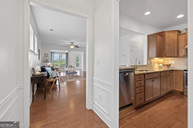 a kitchen with a refrigerator and a sink